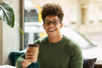 Sticker - Portrait of happy young black guy enjoying coffee