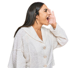 Wall Mural - Young brunette woman wearing casual clothes shouting and screaming loud to side with hand on mouth. communication concept.