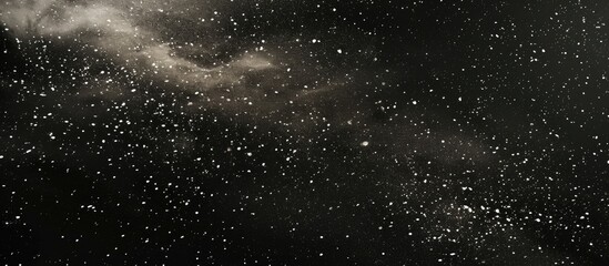 small white specks punctuate the vast black canvas for banner design.
