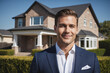 Portrait of friendly male real estate agent showing house that you can buy or rent. Smiling Caucasian middle-aged man in business suit posing in front of home for sale.