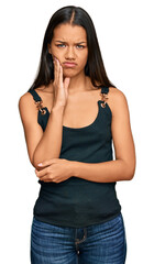 Poster - Beautiful hispanic woman wearing casual clothes thinking looking tired and bored with depression problems with crossed arms.