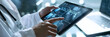 © Sarah - Medical technology, online health, global health network and tourism concept. Doctor using digital tablet and laptop computer, electronic medical record, internet network connection
