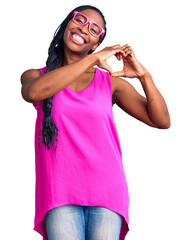 Poster - Young african american woman wearing casual clothes and glasses smiling in love doing heart symbol shape with hands. romantic concept.