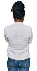 Sticker - Young african american woman wearing business clothes standing backwards looking away with crossed arms