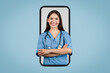 © Prostock-studio - Smiling nurse in virtual screen, healthcare app