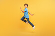 © Prostock-studio - Black boy in mid-run on bright yellow background