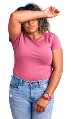 Wall Mural - Young african american plus size woman wearing casual clothes covering eyes with arm, looking serious and sad. sightless, hiding and rejection concept