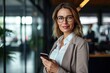 Mid aged business woman holding cellphone standing in office, portrait. Mature 40 years old professional businesswoman manager executive using mobile phone working on smartphone, Generative AI 