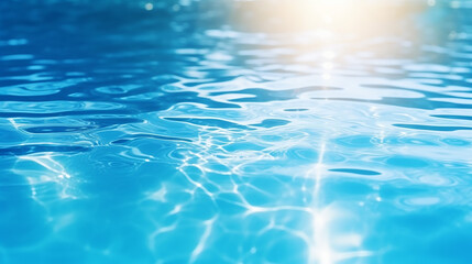blue water surface with bright sunlight reflections