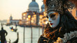 Venice carnival banner with place for text, a man in a carnival costume and mask against the background of a river and gandolas at the Venice carnival