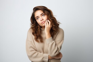 Pensive young plump woman thinking in casual attire isolated  white background 