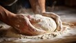 A close-up shot of hands kneading dough for homemade bread