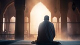Fototapeta Natura - Islamic concept photo. Muslim man praying in the mosque and sunlight rays with haze in the morning. Ramadan or kandil or laylat al-qadr or kadir gecesi background photo. copy space - generative ai