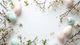 Fototapeta  - Charming flatlay Easter desk with a delightful border of pastel Easter eggs on white table adorned with dainty branches, nest and mini flowers, blank canvas center  for card, paper and product mockups