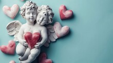  A Statue Of A Cupid Holding A Heart Surrounded By Hearts On A Blue Background With Pink And Red Hearts.