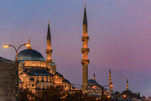 The Yeni Cami Or New Mosque Illuminated In The Morning At Sunrise On The Historic Peninsula In Istanbul, Turkey