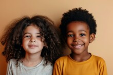 Closeup Portrait Of Two African American Little Girls Isolated On Orange Background