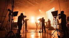 Silhouette Images Of Video Production Behind The Scenes. Making Of TV Commercial Movie That Film Crew Team Lightman And Cameraman Working Together With Film Director In Studio. Film Production Concept