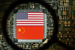 Flags of USA and China on a processor. Computer board with chip. View through magnifying glass