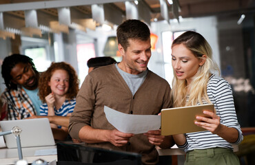 Wall Mural - Successful multiethnic group of designers, architects, business people at work in office