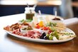 tapenade appetizer platter, cheese and meat accompaniments