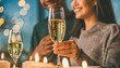 romantic candlelight dinner table setup for couple with beautiful light as background man woman hold glass of champaign concept for valentine s day and date