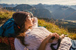 © Westend61 - Backpacker resting on mountain in Tannheimer Tal, Tyrol, Austria