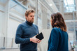 © Westend61 - Businessman holding tablet PC discussing with colleague in industry