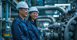 happy two Asian engineers talk and discuss in factory of petrochemical industry