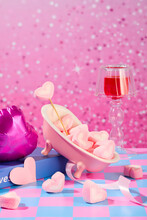Heart-shaped Marshmallows Are Decorated On A Blue-pink Checkered Surface With Props. Outstanding Sparkling Pink Background. Festive Atmosphere.