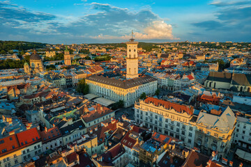 Wall Mural - Rooftops of the old town in Lviv in Ukraine. The magical atmosphere of the European city. Landmark, the city hall and the main square. Drone photo.