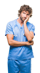 Wall Mural - Handsome hispanic surgeon doctor man over isolated background thinking looking tired and bored with depression problems with crossed arms.