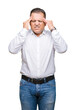 © Krakenimages.com - Middle age arab elegant man over isolated background with hand on head for pain in head because stress. Suffering migraine.
