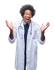 Wall Mural - Afro american doctor man over isolated background celebrating mad and crazy for success with arms raised and closed eyes screaming excited. Winner concept