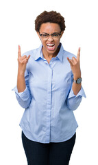 Wall Mural - Young beautiful african american business woman over isolated background shouting with crazy expression doing rock symbol with hands up. Music star. Heavy concept.