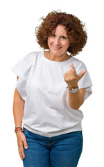 Sticker - Beautiful middle ager senior woman wearing white t-shirt over isolated background Beckoning come here gesture with hand inviting happy and smiling