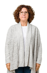 Poster - Beautiful middle ager senior woman wearing jacket and glasses over isolated background Relaxed with serious expression on face. Simple and natural looking at the camera.