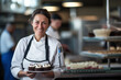 © Iryna - A smiling elderly woman in a professional confectionery, confidently creating delicious desserts with expertise.