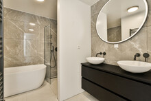 Modern bathroom interior with marble tiles and elegant fixtures