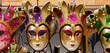 Traditional venetian masks on shelves in souvenirs shop in Venice, Italy. Beautiful carnival masks in variety of colours. Authentic and original Venetian full-face masks for Carnival.