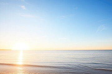 Sticker - sunrise over calm ocean with clear blue sky