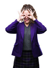 Sticker - Young brunette student girl wearing school uniform and glasses over isolated background doing ok gesture like binoculars sticking tongue out, eyes looking through fingers. Crazy expression.