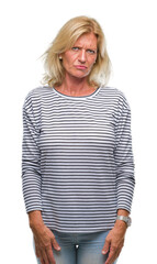 Sticker - Middle age blonde woman over isolated background skeptic and nervous, frowning upset because of problem. Negative person.