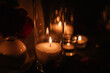 Burning candles for surprise marriage proposal. Luxury candlelight date in restaurant. Romantic dinner setup at night. Table set for couple, Valentine's Day evening. Decoration candle. Details closeup