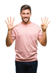 Sticker - Young handsome man over isolated background showing and pointing up with fingers number nine while smiling confident and happy.