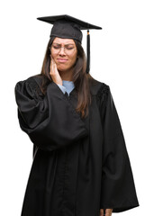 Sticker - Young hispanic woman wearing graduated cap and uniform touching mouth with hand with painful expression because of toothache or dental illness on teeth. Dentist concept.