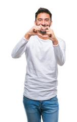 Sticker - Adult hispanic man over isolated background smiling in love showing heart symbol and shape with hands. Romantic concept.