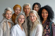 © txemag - Studio portrait of a multiethnic group of seven mature women against a grey background