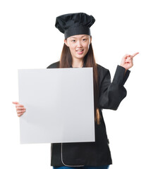 Wall Mural - Young Chinese woman over isolated background wearing chef uniform holding banner very happy pointing with hand and finger to the side