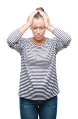 Sticker - Young beautiful caucasian woman over isolated background suffering from headache desperate and stressed because pain and migraine. Hands on head.